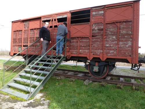 Stoney looking into one of the actual convoy train cars with our friend and guide.